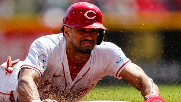 Apr 7, 2024; Cincinnati, Ohio, USA; Cincinnati Reds center fielder Bubba Thompson (12) steals third base in the third inning against the New York Mets at Great American Ball Park. Mandatory Credit: Katie Stratman-Imagn Images
