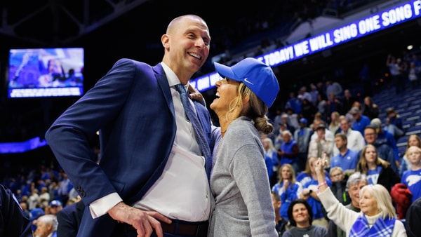 Nov 29, 2024; Lexington, Kentucky, USA; Kentucky Wildcats head coach Mark Pope talks with his wife Lee Anne after the game against the Georgia State Panthers at Rupp Arena at Central Bank Center. Mandatory Credit: Jordan Prather-Imagn Images