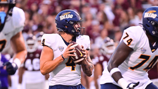 Sep 14, 2024; Starkville, Mississippi, USA; Toledo Rockets quarterback Tucker Gleason (4) looks to pass against the Mississippi State Bulldogs during the first quarter at Davis Wade Stadium at Scott Field. Mandatory Credit: Matt Bush-Imagn Images