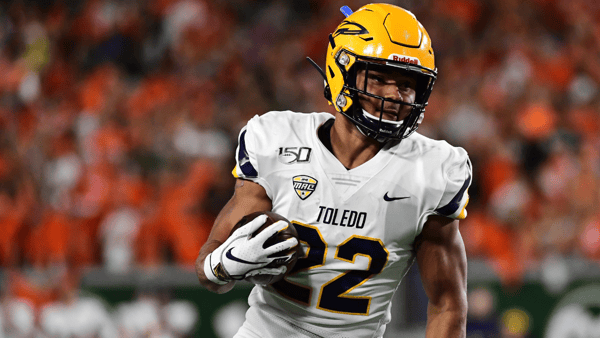 Sep 21, 2019; Fort Collins, CO, USA; Toledo Rockets running back Bryant Koback (22) carries the ball against the Colorado State Rams in the first quarter at Sonny Lubrick Field at Canvas Stadium. Mandatory Credit: Ron Chenoy-Imagn Images