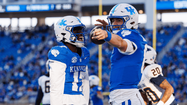Nov 16, 2024; Lexington, Kentucky, USA; Kentucky Wildcats quarterback Cutter Boley (8) and wide receiver Hardley Gilmore IV (17) celebrate a first down during the third quarter against the Murray State Racers at Kroger Field. Mandatory Credit: Jordan Prather-Imagn Images
