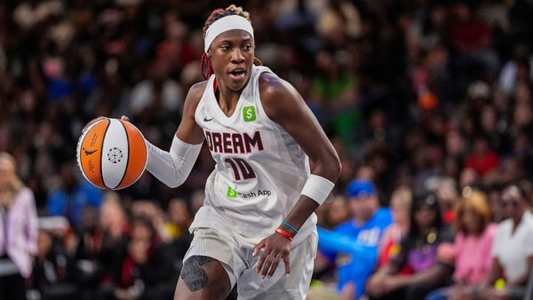 Aug 27, 2025; College Park, Georgia, USA; Atlanta Dream guard Rhyne Howard (10) controls the ball against the Las Vegas Aces during the second half at Gateway Center Arena at College Park. Mandatory Credit: Dale Zanine-Imagn Images