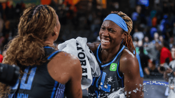 Sep 8, 2025; College Park, Georgia, USA; Atlanta Dream forward Naz Hillmon (0) and guard Rhyne Howard (10) laugh together after the victory against the Connecticut Sun at Gateway Center Arena at College Park. Mandatory Credit: Jordan Godfree-Imagn Images