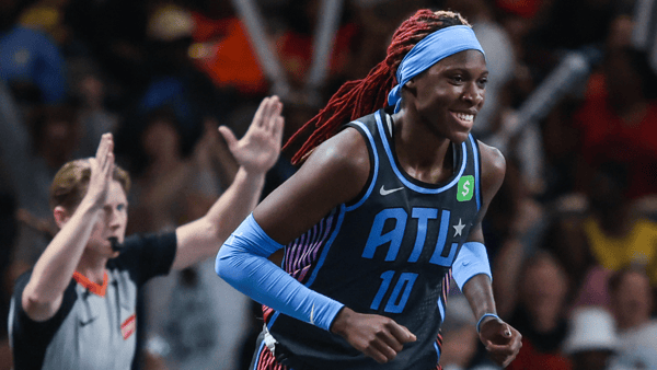 Sep 5, 2025; College Park, Georgia, USA; Atlanta Dream guard Rhyne Howard (10) smiles after shooting a three point shot against the Los Angeles Sparks during the first quarter at Gateway Center Arena at College Park. Mandatory Credit: Jordan Godfree-Imagn Images