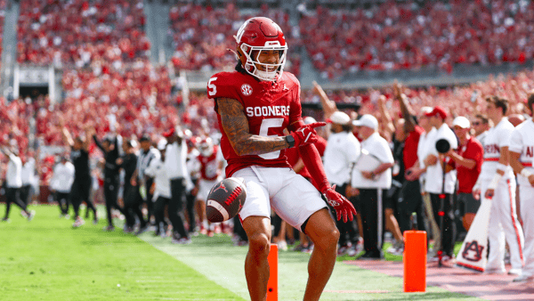 Sep 20, 2025; Norman, Oklahoma, USA; Oklahoma Sooners wide receiver Isaiah Sategna III (5) reacts after catching a touchdown pass during the first half against the Auburn Tigers at Gaylord Family-Oklahoma Memorial Stadium. Mandatory Credit: Kevin Jairaj-Imagn Images