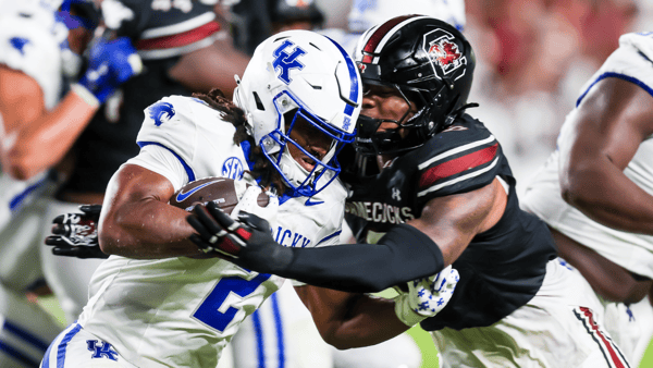 Sep 27, 2025; Columbia, South Carolina, USA; Kentucky Wildcats running back Dante Dowdell (2) is stopped by South Carolina Gamecocks linebacker Dylan Stewart (6) in the second quarter at Williams-Brice Stadium. Mandatory Credit: Jeff Blake-Imagn Images