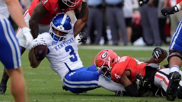Kentucky RB Seth McGowan is gobbled up by the Georgia defense, via Dale Zanine, Imagn Images