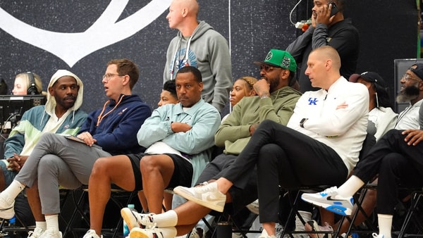 July 19, 2025; North Augusta, South Carolina, USA; NBA star Carmelo Anthony (center right) talks to University of Kentucky basketball coach Mark Pope (right) during the Team Why Not and Team CP3 game at the Nike EYBL Peach Jam at Riverview Park Activity Center. Team Why Not won 66-63. Mandatory Credit: Katie Goodale - Augusta Chronicle/USA TODAY NETWORK