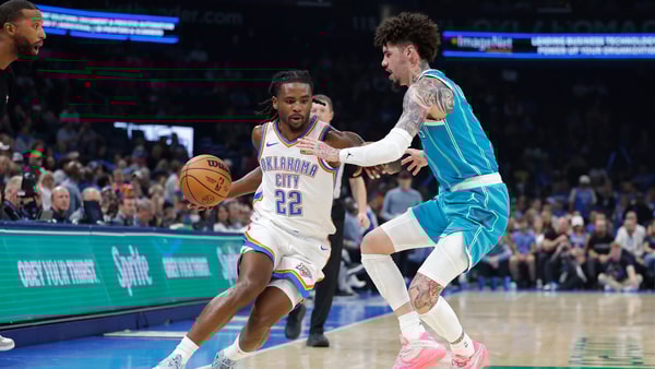 Oct 9, 2025; Oklahoma City, Oklahoma, USA; Oklahoma City Thunder guard Cason Wallace (22) drives around Charlotte Hornets guard Lamelo Ball (1) during the second quarter of a game between the Charlotte Hornets and the Oklahoma City Thunder at Paycom Center. Mandatory Credit: Alonzo Adams-Imagn Images