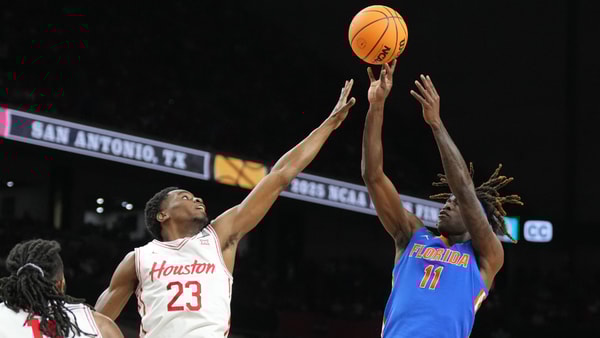 Apr 7, 2025; San Antonio, TX, USA; Florida Gators guard Denzel Aberdeen (11) shoots over Houston Cougars guard Terrance Arceneaux (23) in the first half in the national championship game of the Final Four of the 2025 NCAA Tournament at the Alamodome. Mandatory Credit: Robert Deutsch-Imagn Images