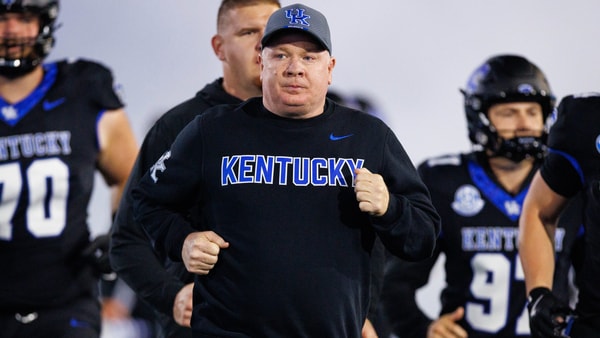 Oct 25, 2025; Lexington, Kentucky, USA; Kentucky Wildcats head coach Mark Stoops runs onto the field before the game against the Tennessee Volunteers at Kroger Field. Mandatory Credit: Jordan Prather-Imagn Images