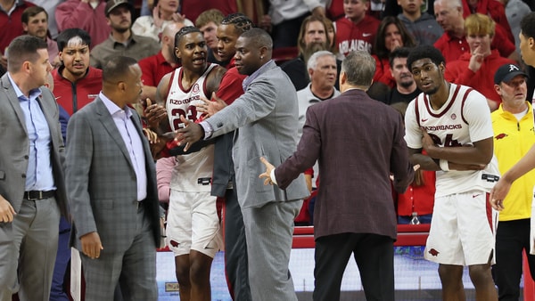 John Calipari had to restrain Arkansas forward Nick Pringle at the end of a nail-biting win over Winthrop, via Nelson Chenault-Imagn Images