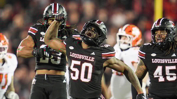 Louisville Cardinals defensive lineman Clev Lubin (50) celebrates his tackle of Clemson Tigers quarterback Cade Klubnik (2) in the first half at L&N Stadium Friday, Nov. 14, 2025. (© Matt Stone/Courier Journal / USA TODAY NETWORK via Imagn Images)