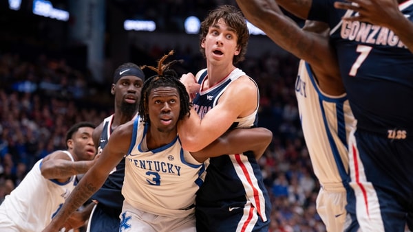 Kentucky guard Kam Williams (3) and Gonzaga forward Braden Huff (34) get tangled up on a block out during their game at Bridgestone Arena in Nashville Friday, Dec. 5, 2025. © Denny Simmons / The Tennessean / USA TODAY NETWORK via Imagn Images