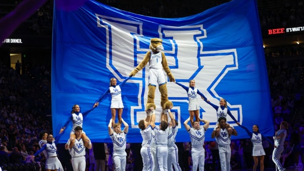 The Kentucky Wildcat and cheerleaders form a pyramid at Rupp Arena, via Mont Dawson, KSR