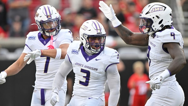 The James Madison defense celebrates against Louisville, via Jamie Rhodes-Imagn Images