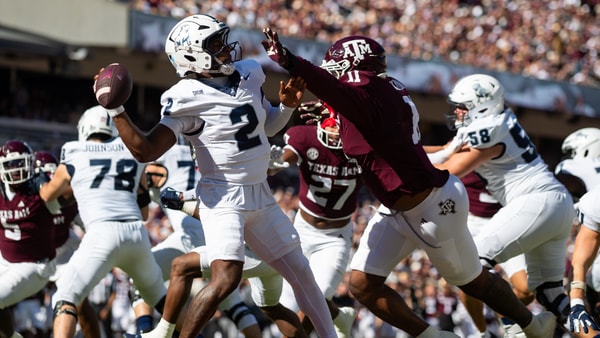 The Texas AM defense swarms an opposing quarterback, via Joseph Buvid-Imagn Images