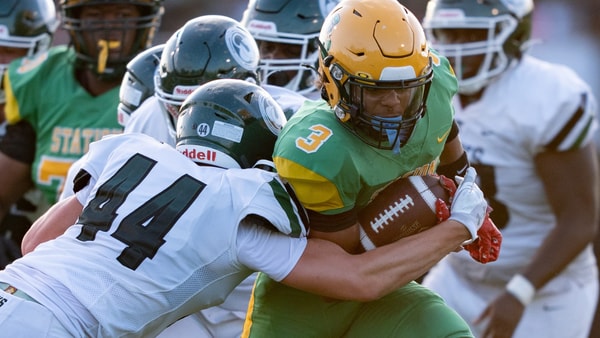 Trinity's Nick Lococo (44) tackles Bryan Station's Jordan Haskins (3) during their game on Friday, Aug. 23, 2024 at Bryan Station High School in Lexington, Ky.