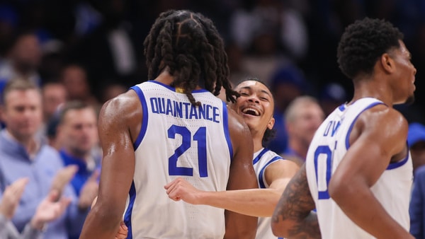 Dec 20, 2025; Atlanta, Georgia, USA; Kentucky Wildcats forward Jayden Quaintance (21) reacts with St. John Red Storm guard Jaland Lowe (15) in the second half at State Farm Arena. Mandatory Credit: Brett Davis-Imagn Images