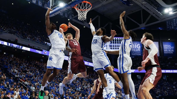 Dec 23, 2025; Lexington, Kentucky, USA; Bellarmine Knights forward Jack Karasinski (32) goes to the basket against Kentucky Wildcats guard Otega Oweh (00) and forward Mouhamed Dioubate (23) during the first half at Rupp Arena at Central Bank Center. Mandatory Credit: Jordan Prather-Imagn Images