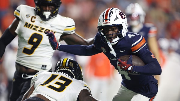 Oct 18, 2025; Auburn, Alabama, USA; Missouri Tigers defensive back Daylan Carnell (13) goes to tackle Auburn Tigers wide receiver Malcolm Simmons (4) during the first quarter at Jordan-Hare Stadium. Mandatory Credit: John Reed-Imagn Images