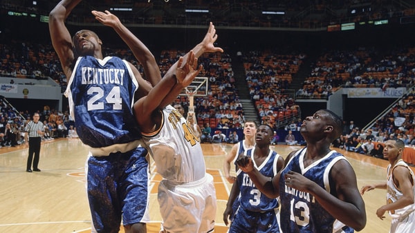 Kentucky PF Antoine Walker goes for a rebound against Tennessee in 1996, via RVR Photos-Imagn Images