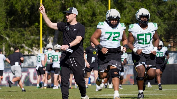 Oregon offensive coordinator Will Stein walks the field as the Oregon Ducks practice at Barry University ahead of the Orange Bowl on Dec. 30, 2025, in Miami, Florida. (© Ben Lonergan/The Register-Guard / USA TODAY NETWORK via Imagn Images)