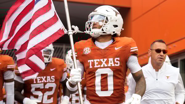 Sep 6, 2025; Austin, Texas, USA; Texas Longhorns wide receiver DeAndre Moore Jr. (0) leads players on to the field before the game against the San Jose State Spartans at Darrell K Royal-Texas Memorial Stadium. Mandatory Credit: Scott Wachter-Imagn Images