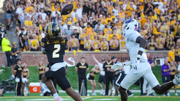 Aug 28, 2025; Columbia, Missouri, USA; Missouri Tigers wide receiver Marquis Johnson (2) catches a pass and runs for a touchdown as Central Arkansas Bears defensive back L.J. Hewitt (0) chases during the first half of the game at Faurot Field at Memorial Stadium. Mandatory Credit: Denny Medley-Imagn Images