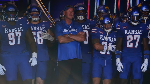 Kansas Jayhawks head coach Lance Leipold brings his team out before the game between Fresno State and Kansas at David Booth Kansas Memorial Stadium. (© Evert Nelson/The Capital-Journal / USA TODAY NETWORK via Imagn Images)