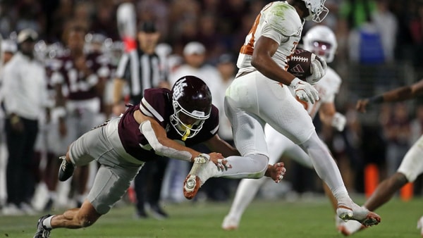 Oct 25, 2025; Starkville, Mississippi, USA; Texas Longhorns wide receiver/running back Ryan Niblett (21) returns a punt as he breaks a tackle attempt by Mississippi State Bulldogs defensive back Cyrus Reyes (19) during the fourth quarter at Davis Wade Stadium at Scott Field. Mandatory Credit: Petre Thomas-Imagn Images