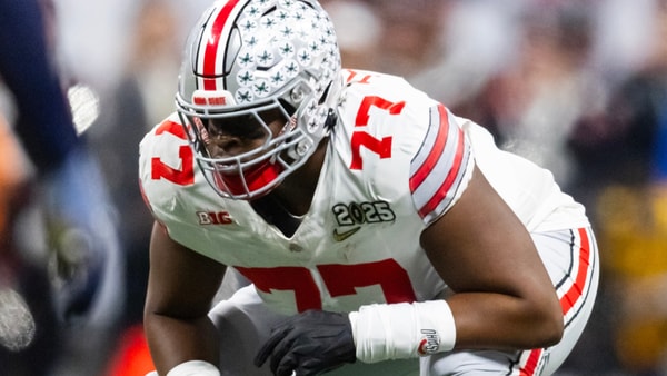Jan 20, 2025; Atlanta, GA, USA; Ohio State Buckeyes offensive lineman Tegra Tshabola (77) against the Notre Dame Fighting Irish during the CFP National Championship college football game at Mercedes-Benz Stadium. Mandatory Credit: Mark J. Rebilas-Imagn Images
