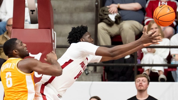 Jan 24, 2026; Tuscaloosa, AL, USA; Alabama center Charles Bediako (14) reaches out to grab a rebound against Tennessee forward Dewayne Brown II (6) at Coleman Coliseum. Mandatory Credit: Gary Cosby Jr.-Tuscaloosa News