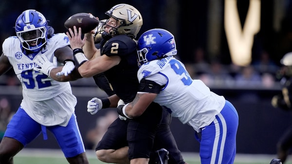Vanderbilt quarterback Diego Pavia (2) is brought down from behind by Kentucky defensive lineman Mi'Quise Humphrey-Grace (90) during the second quarter at FirstBank Stadium in Nashville, Tenn., Saturday, Nov. 22, 2025. (© Mark Zaleski / The Tennessean / USA TODAY NETWORK via Imagn Images)