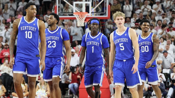 Jan 31, 2026; Fayetteville, Arkansas, USA; Kentucky Wildcats players return to the court after a timeout during the second half against the Arkansas Razorbacks at Bud Walton Arena. Kentucky won 85-77. Mandatory Credit: Nelson Chenault-Imagn Images