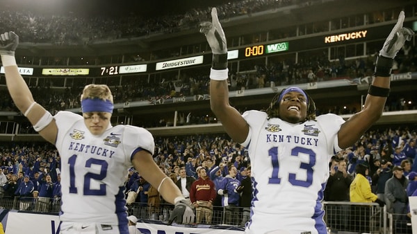Kentucky teammate Dicky Lyons Jr. (12) and Steve Johnson (13) celebrate their win against Florida State, 35-28, in the Music City Bowl in Nashville on Dec. 31, 2007. (© John Partipilo / The Tennessean, Nashville Tennessean via Imagn Content Services, LLC)