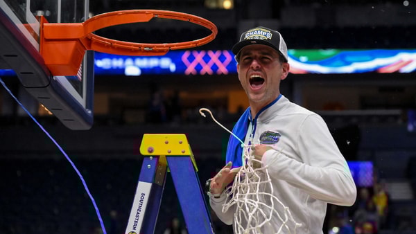 Mar 16, 2025; Nashville, TN, USA; Florida Gators head coach Todd Golden celebrates the win with cutting down the net against the Tennessee Volunteers at the 2025 SEC Championship Game at Bridgestone Arena. Mandatory Credit: Steve Roberts-Imagn Images