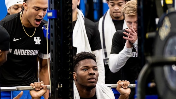Kentucky football players rally around their teammates in the weight room, via UK Athletics