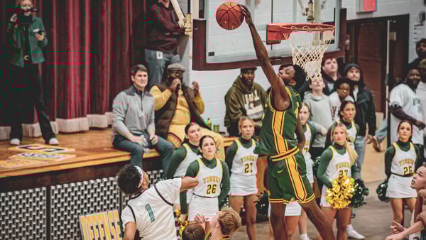 St. Xavier's Jeremiah Jackson blocks a J-Town shot. Photo by Daniel Campbell