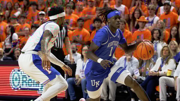 Feb 14, 2026; Gainesville, Florida, USA; Kentucky Wildcats guard Denzel Aberdeen (1) drives to the basket past Florida Gators guard Boogie Fland (0) during the first half at Exactech Arena at the Stephen C. O'Connell Center. Mandatory Credit: Matt Pendleton-Imagn Images