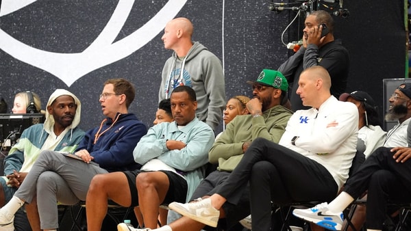 July 19, 2025; North Augusta, South Carolina, USA; NBA star Carmelo Anthony (center right) talks to University of Kentucky basketball coach Mark Pope (right) during the Team Why Not and Team CP3 game at the Nike EYBL Peach Jam at Riverview Park Activity Center. Team Why Not won 66-63. Mandatory Credit: Katie Goodale - Augusta Chronicle/USA TODAY NETWORK