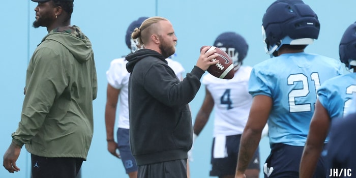 UNC defensive coordinator Steve Belichick and inside linebackers coach Jamie Collins