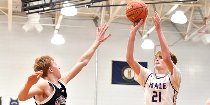 Male’s Trey Hillerich (21) shoots over the defense of Frederick Douglass' Tate Robinson (13) during the first half of their game in the King Of The Bluegrass Tournament, Thursday, Dec. 19 2024 in Louisville Ky.  © Timothy D. Easley/Special to the Courier-Journal / USA TODAY NETWORK via Imagn Images