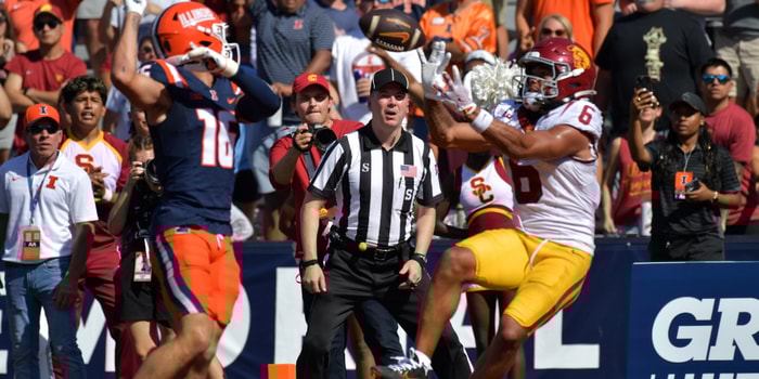 USC Trojans wide receiver Makai Lemon (6) scores a touchdown on a pass from quarterback Jayden Maiava (14) as Illinois Fighting Illini defensive back Tanner Heckel (16) defends during the second half at Memorial Stadium