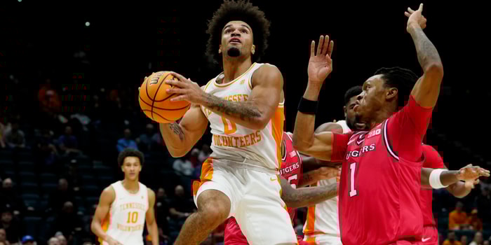 Nov 24, 2025; Las Vegas, NV, USA; Tennessee Volunteers guard Ja'Kobi Gillespie (0) looks to shoot over Rutgers Scarlet Knights guard Jamichael Davis (1) during the first half in a 2025 Players Era Festival group play game at MGM Grand Garden Arena. Mandatory Credit: Stephen R. Sylvanie-Imagn Images