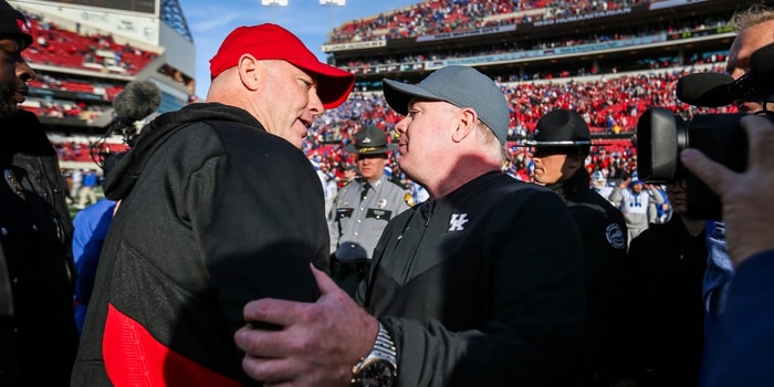 Louisville head coach Jeff Brohm congratulates Kentucky head coach Mark Stoops after the Wildcats beat Louisville 38-31 Saturday and retaining the Governor's Cup. It was Brohm's first Governor's Cup game as head coach for UofL. Nov. 24, 2023. © Matt Stone/The Courier Journal / USA TODAY NETWORK