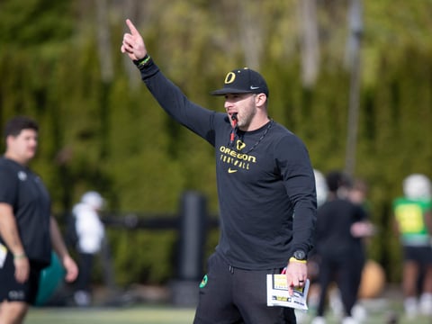 Oregon tight ends coach Drew Mehringer works with players during practice with the Ducks Thursday, April 11, 2024, at the