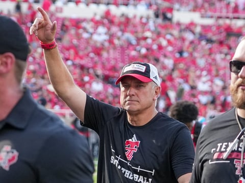 Texas Tech head coach Joey McGuire gestures to the fans before a non-conference Division I football game, Saturday, Sept. 5,