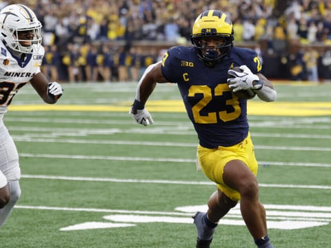 Sep 19, 2026; Ann Arbor, Michigan, USA; Michigan Wolverines running back Jordan Marshall (23) scores a touchdown with Texas El Paso Miners defensive back Adarius Hutchinson (32) defending during the third quarter at Michigan Stadium. Mandatory Credit: Rick Osentoski-Imagn Images