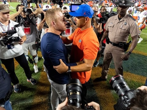 2026-09-20T030704Z_1932107654_MT1USATODAY29868360_RTRMADP_3_AUBURN-TIGERS-HEAD-COACH-ALEX-GOLESH-AND-FLORIDA-GATORS-HEAD (1)